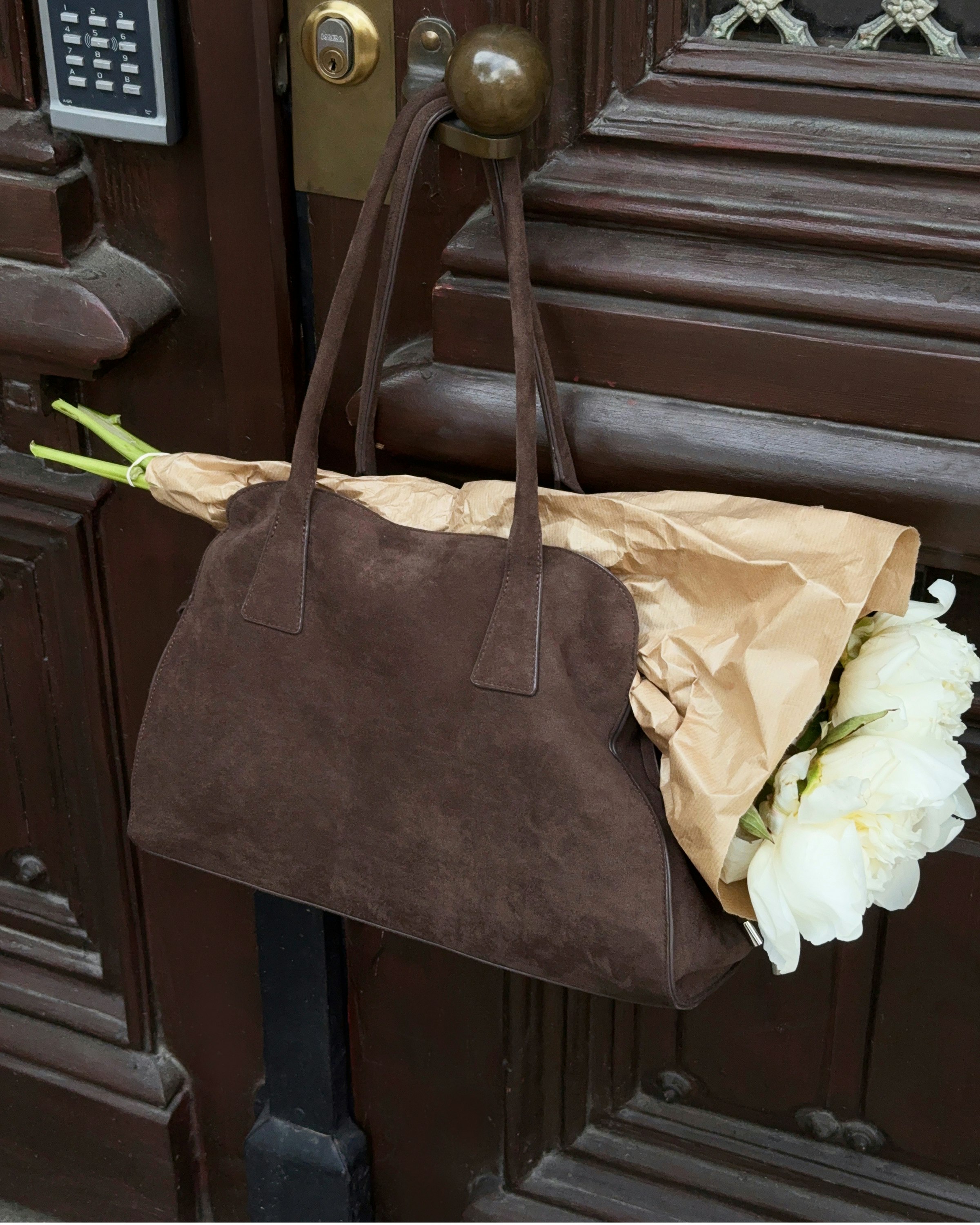 Dark brown shoulder bag with suede-like finish, sleek for everyday style.